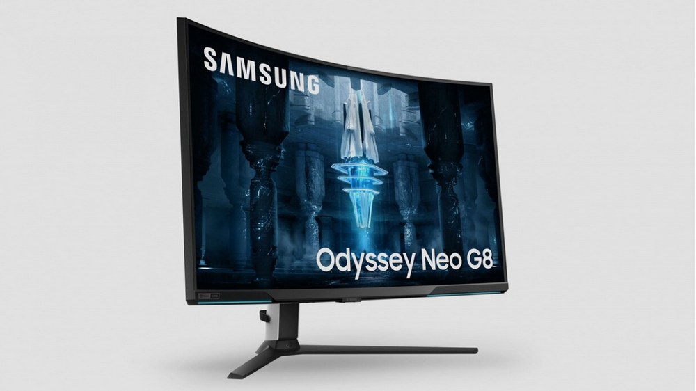 مانیتور Samsung Odyssey Neo G8 که در یک پس زمینه سفید رنگ قرار گرفته است و کریستالی آبی داخل نمایشگر وجود دارد