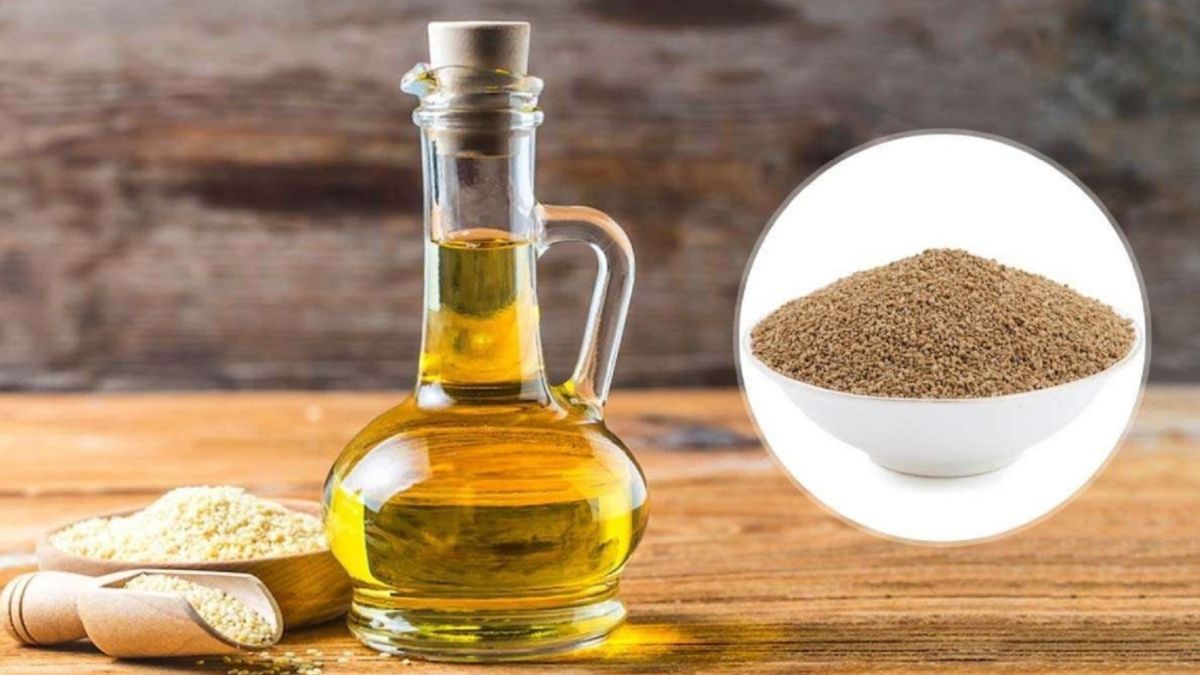 عرق زنیان روی میز کنار دانه‌های زنیان