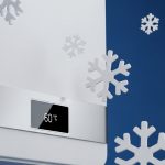 نمای نزدیک از یک پکیج دیواری با دانه‌های برف در پس‌زمینه آبی تیره